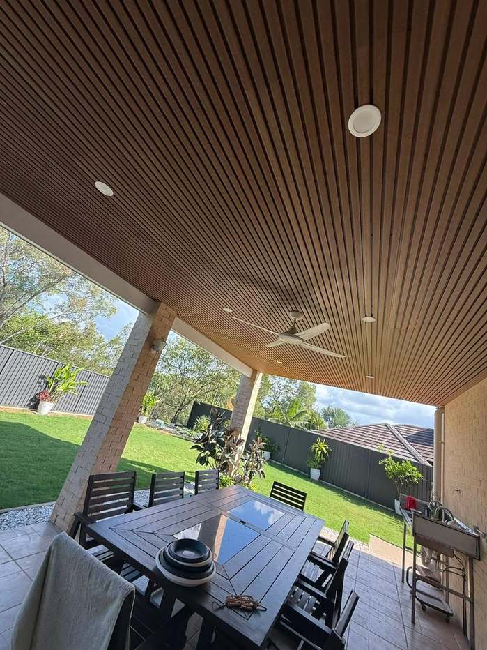 Covered alfresco with a timber batten lined ceiling, downlights and a ceiling fan